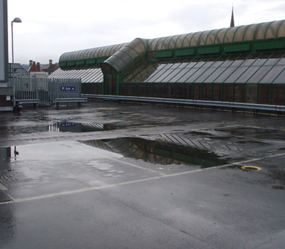 Image of ponding water on an asphalt car park
