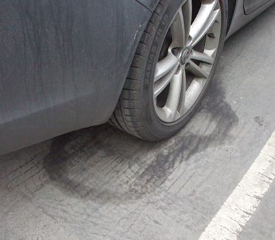 Image of wheel indentations on an asphalt car park